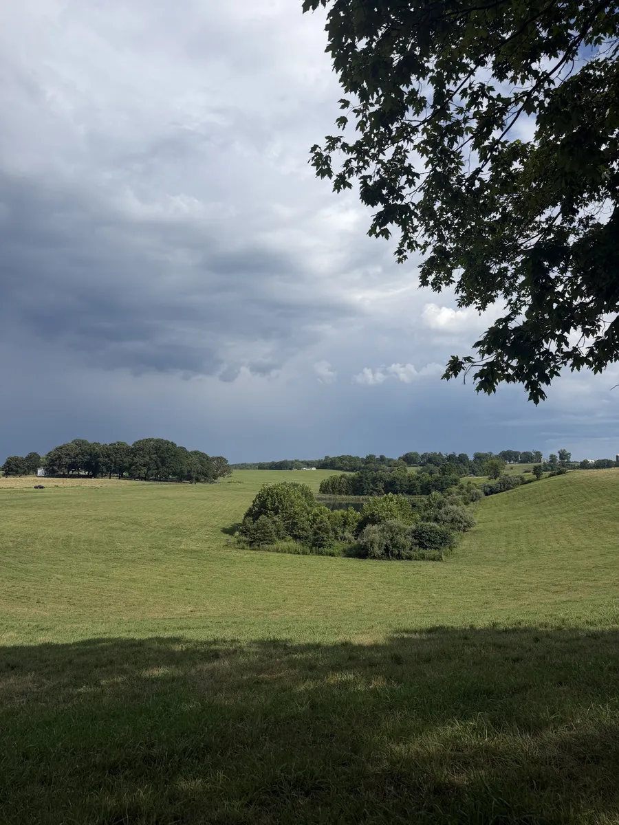 Storm clouds over the rolling fields of Maranatha Farms